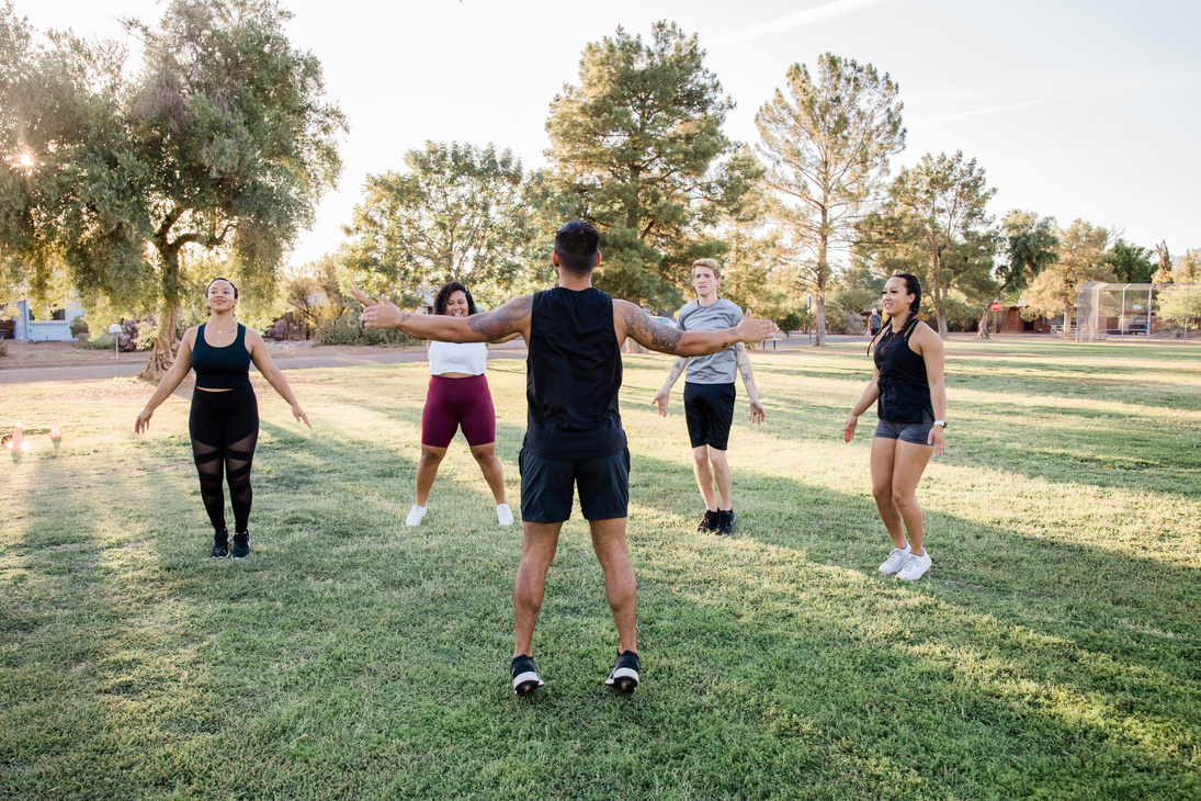 Diverse Group of Athletes Exercising Outdoors